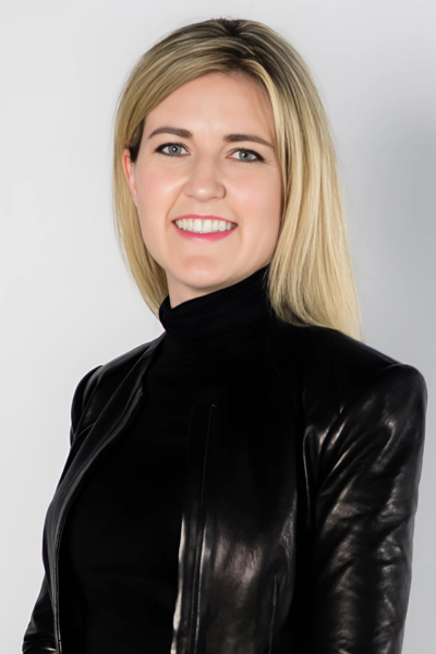 Nikki Greenberg headshot on a white grey background