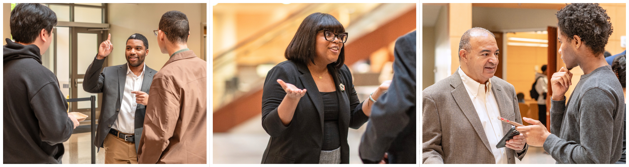 Professionals and students enthusiastically engage in discussions during a business school event in a modern atrium.