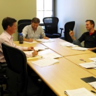 Andrew Bennett in a meeting with faculty and peers