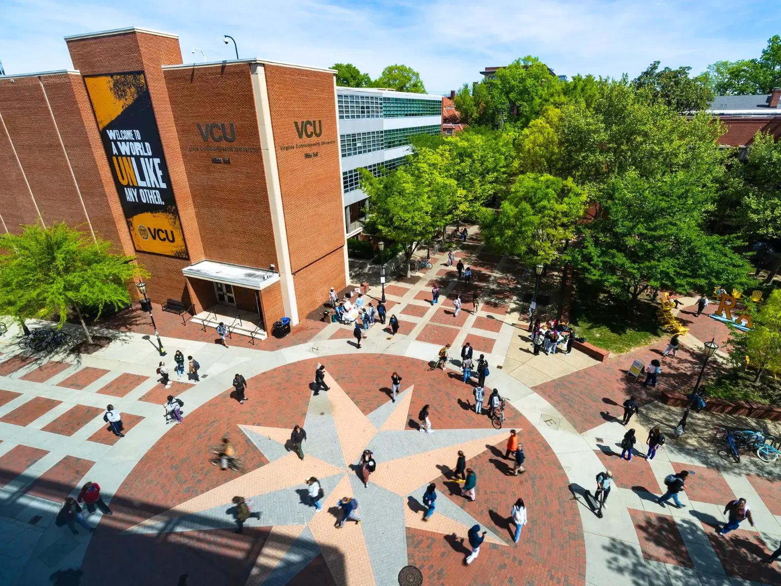 Students walking through VCU’s Compass plaza.