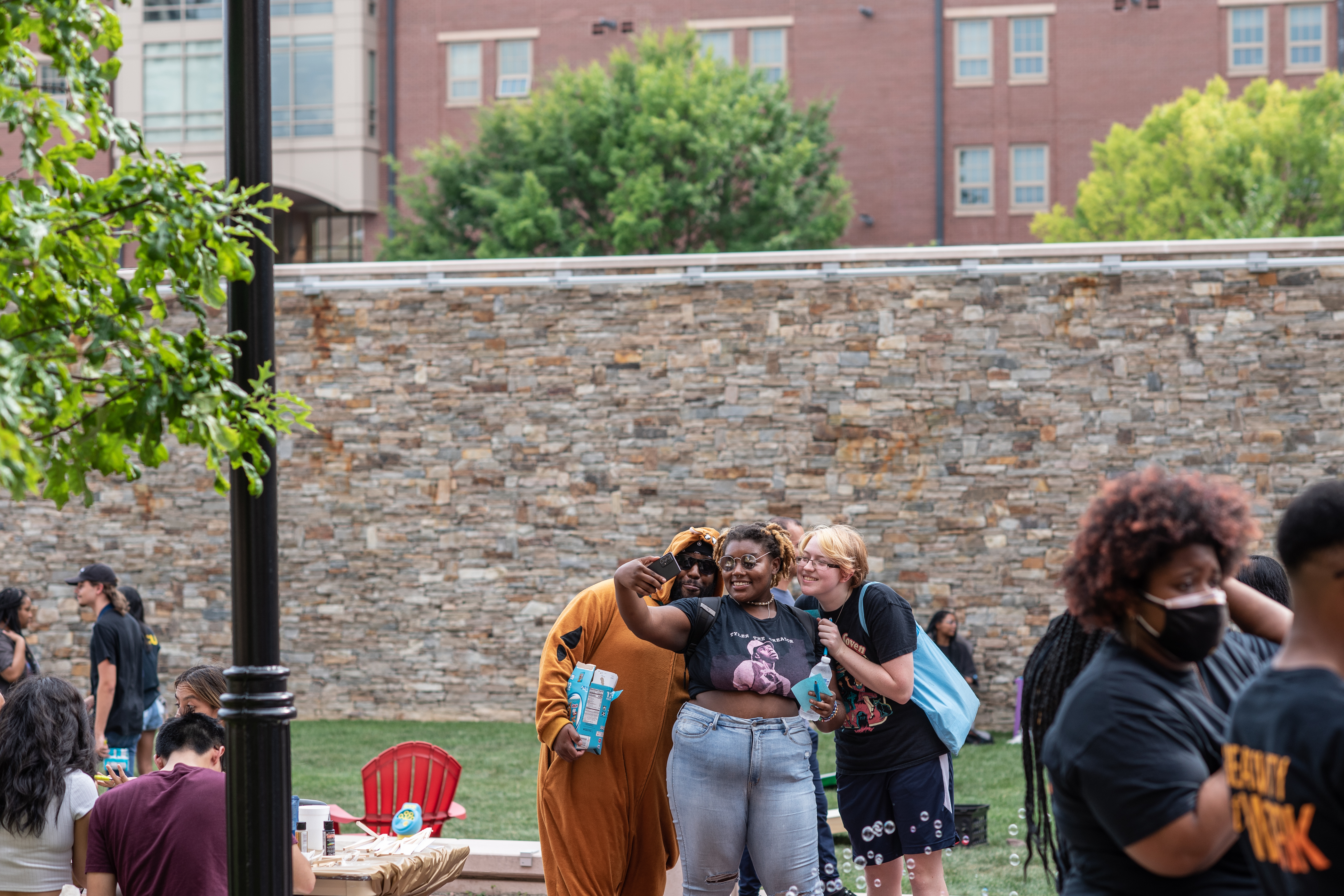 Students taking a selfie with scooby